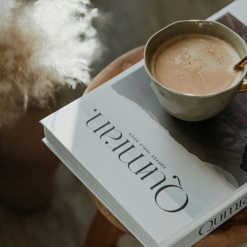 a cup of coffee on a book
